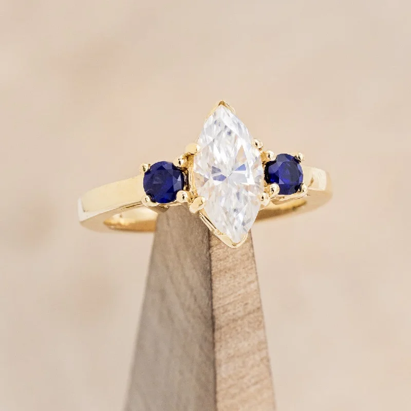 MARQUISE CUT MOISSANITE ENGAGEMENT RING WITH LAB-GROWN DARK BLUE SAPPHIRE ACCENTS