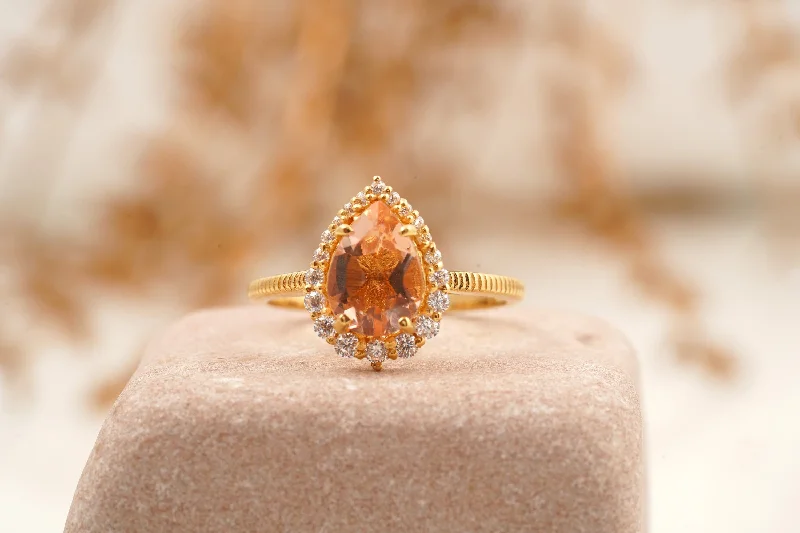 Topaz Gemstone Rings with a Faceted Cut and Shimmering EffectPear Cut Morganite Halo Diamond Engagement Ring