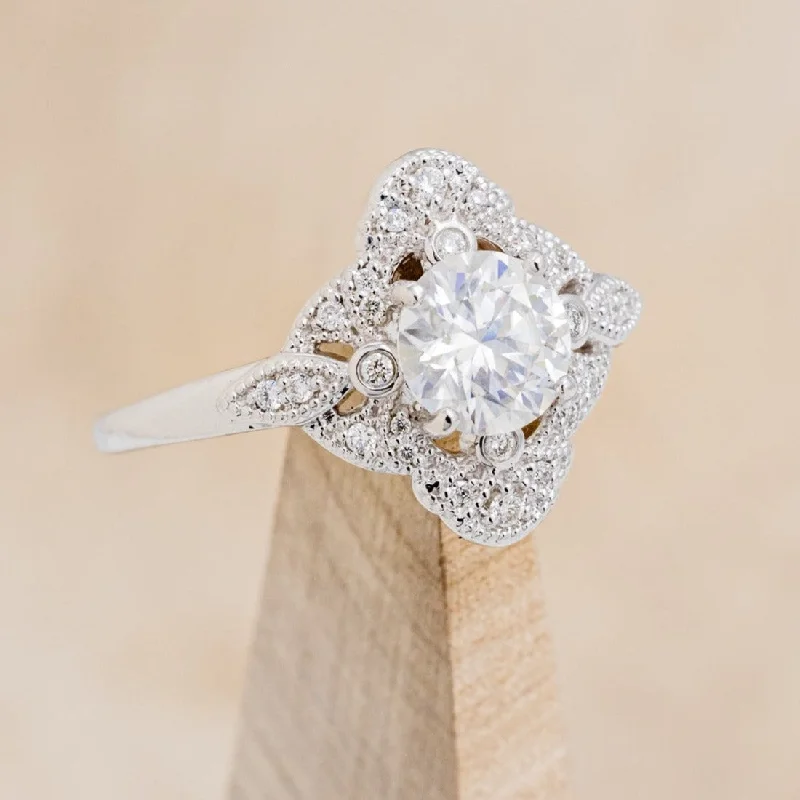 "FLORENCE" - ROUND CUT MOISSANITE ENGAGEMENT RING WITH DIAMOND ACCENTS